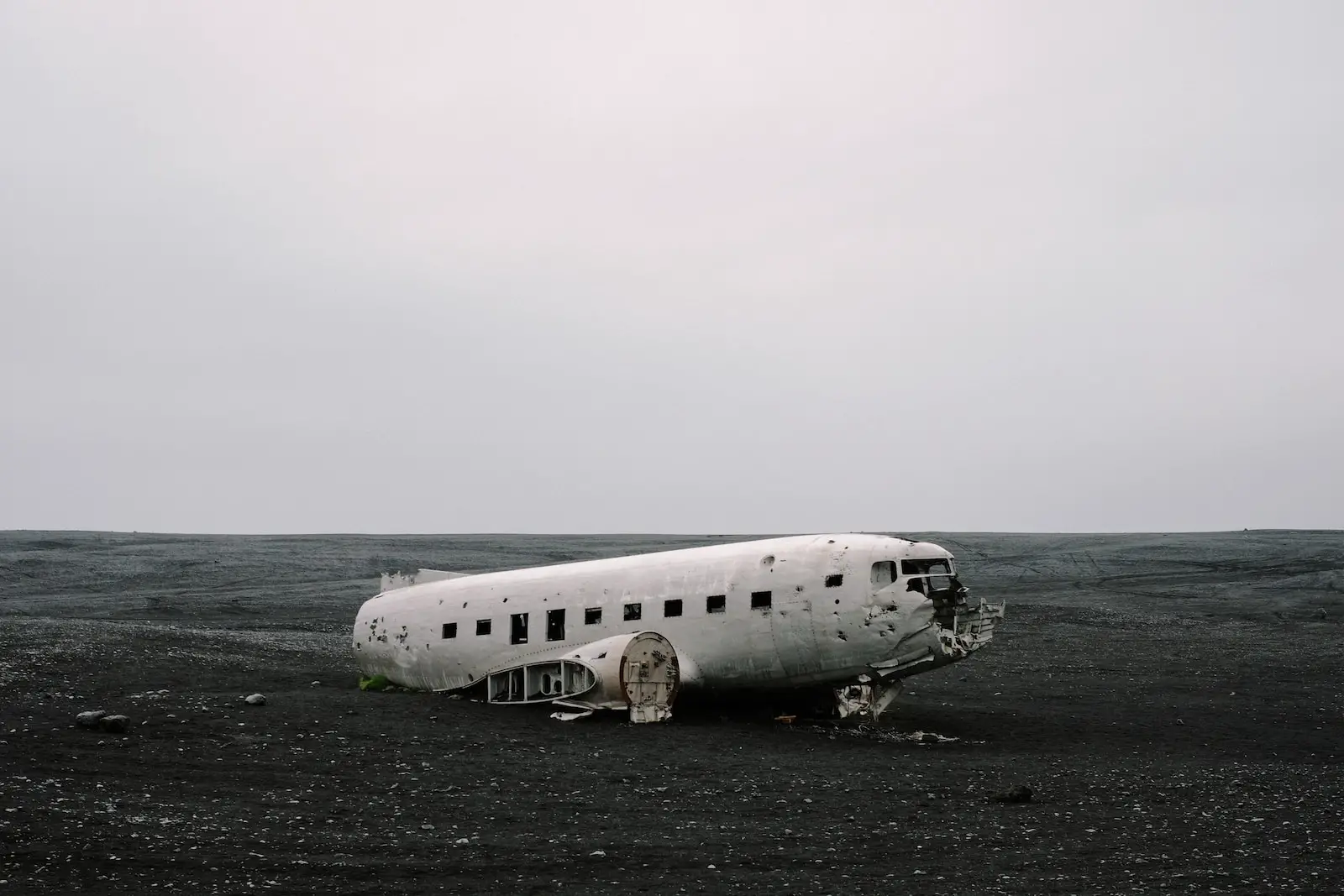 wrecked air plane on gray sand