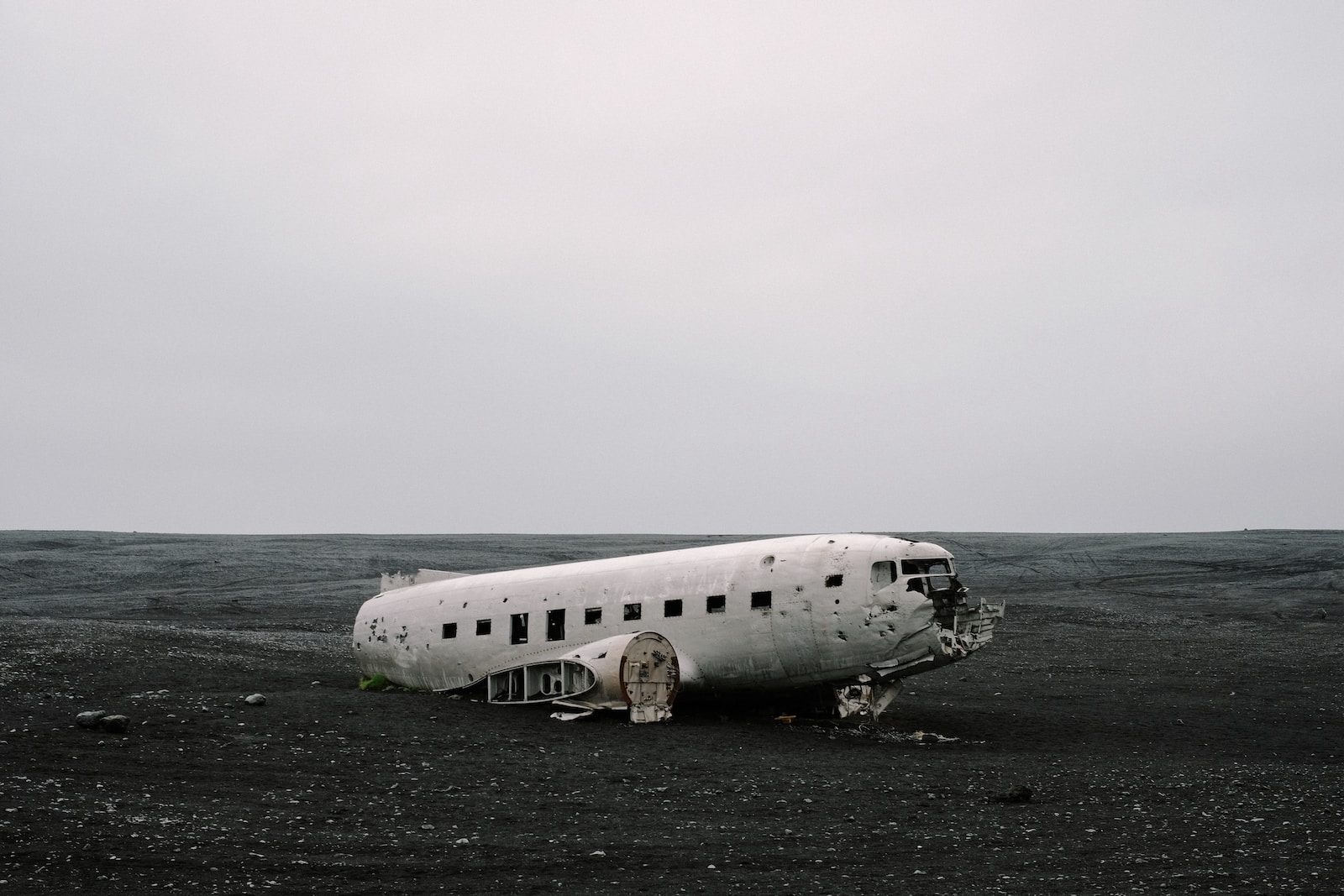 wrecked air plane on gray sand